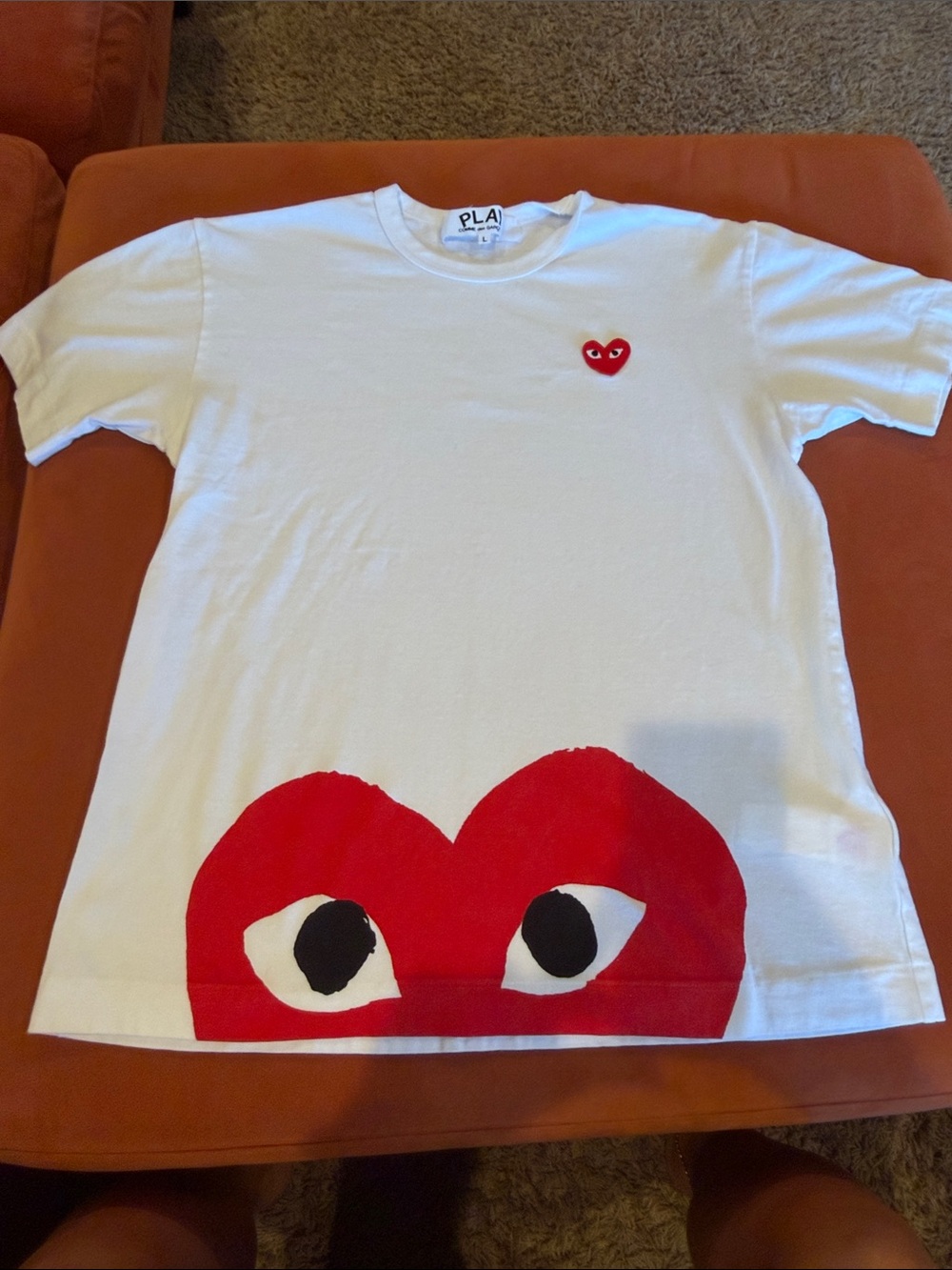Comme des Garcons mens White Tee with Red Heart Eye Graphic